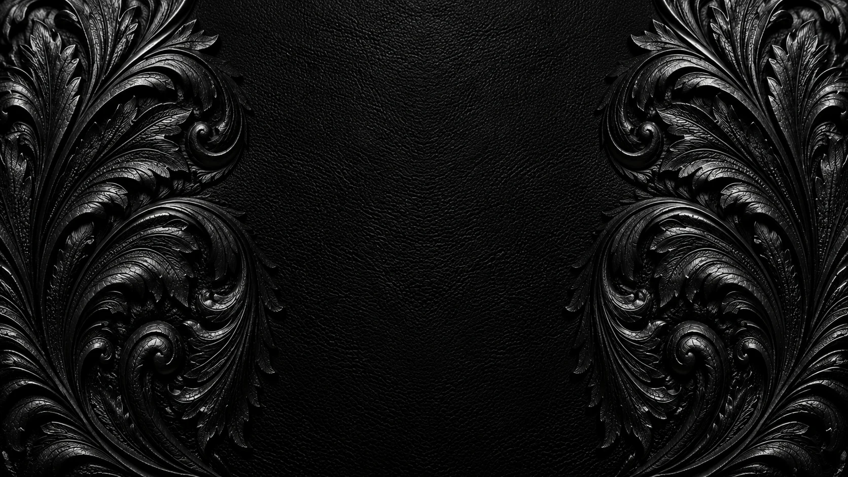 Black leather with symmetrical hand-tooled Western floral engraving